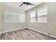This is a home office with a white board, natural light, and light wood flooring at 3437 Visionary Bay Ave, North Las Vegas, NV 89081