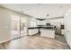 Modern kitchen with stainless steel appliances, an island, granite countertops, and recessed lights at 3437 Visionary Bay Ave, North Las Vegas, NV 89081
