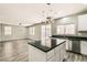 Modern kitchen with stainless steel appliances, granite countertops, an island, and recessed lights at 3437 Visionary Bay Ave, North Las Vegas, NV 89081