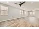 Spacious living room featuring hardwood floors, recessed lighting, and a modern ceiling fan at 3437 Visionary Bay Ave, North Las Vegas, NV 89081