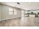 Open-concept living and dining room, showing hardwood floors, recessed lights, and the kitchen at 3437 Visionary Bay Ave, North Las Vegas, NV 89081