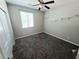 Neutral bedroom featuring plush carpeting, a ceiling fan, window, and built in shelving at 3708 Fuselier Dr, North Las Vegas, NV 89032