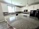 Modern kitchen features granite countertops, stainless steel appliances, and ample cabinet space at 3708 Fuselier Dr, North Las Vegas, NV 89032