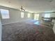 Bright and spacious open-concept living area with large windows and a tiled kitchen island at 3708 Fuselier Dr, North Las Vegas, NV 89032