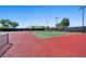 Outdoor tennis courts featuring well-maintained surfaces surrounded by high fencing at 3708 Fuselier Dr, North Las Vegas, NV 89032