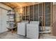Basement laundry area featuring a washer, dryer, and water heater at 4280 Cicada Way, Las Vegas, NV 89121