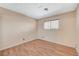 Bedroom with wood floor, large window and blank walls ready for decoration at 4280 Cicada Way, Las Vegas, NV 89121