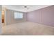 Spacious bedroom features neutral carpet, ceiling fan, and large window providing great natural light at 4280 Cicada Way, Las Vegas, NV 89121