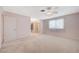 Spacious bedroom features neutral carpet, ceiling fan, and sliding mirror closet doors at 4280 Cicada Way, Las Vegas, NV 89121