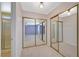 Large mirrored closet, with lighting, leads to a bedroom and ensuite bathroom with shower at 4280 Cicada Way, Las Vegas, NV 89121