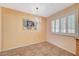 Cozy dining area with tile floors, a chandelier, and plantation shutters at 4280 Cicada Way, Las Vegas, NV 89121