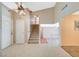 Inviting entryway featuring tile flooring, a staircase, and a decorative light fixture at 4280 Cicada Way, Las Vegas, NV 89121