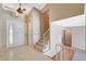 Inviting foyer with tile flooring, a staircase, and a stylish front door with decorative glass accents at 4280 Cicada Way, Las Vegas, NV 89121
