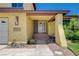 Covered entry with brick accents and desert landscaping at 4280 Cicada Way, Las Vegas, NV 89121