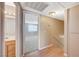 Upstairs hallway with wood floors leading to a bedroom and bathroom with warm paint and a linen closet at 4280 Cicada Way, Las Vegas, NV 89121