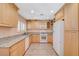 Kitchen featuring granite countertops, updated appliances, and wood cabinets at 4280 Cicada Way, Las Vegas, NV 89121