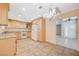 Spacious kitchen with tile floors, granite counters, and modern white appliances at 4280 Cicada Way, Las Vegas, NV 89121