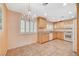 Bright kitchen with tile floors, chandelier, wood cabinetry, and ample counter space at 4280 Cicada Way, Las Vegas, NV 89121