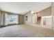 Bright living room with large window and neutral carpet at 4280 Cicada Way, Las Vegas, NV 89121