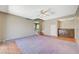 Entertain in this spacious living room with carpet, wet bar, and stair access to the main entry at 4280 Cicada Way, Las Vegas, NV 89121