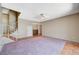 Comfortable living room features a wet bar and step-up access to the entry and stairs to upper level at 4280 Cicada Way, Las Vegas, NV 89121