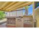 Backyard patio with built-in grill and stone counter area at 4280 Cicada Way, Las Vegas, NV 89121