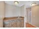 Convenient wet bar featuring a sink, wood cabinets, and easy access to other areas of the home at 4280 Cicada Way, Las Vegas, NV 89121