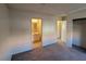 The bedroom has carpet flooring, neutral walls, and an adjacent bathroom with tile flooring at 4300 N Lamont St # 232, Las Vegas, NV 89115