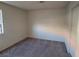 This bedroom has neutral walls, carpet flooring, a window with blinds and a closet at 4300 N Lamont St # 232, Las Vegas, NV 89115
