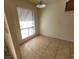 The dining area features tile flooring, a hanging light fixture and a large window with view at 4300 N Lamont St # 232, Las Vegas, NV 89115