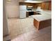 Spacious kitchen featuring tile floors, a breakfast bar, and ample cabinet space at 4300 N Lamont St # 232, Las Vegas, NV 89115