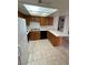 Well-lit kitchen with tile flooring, wood cabinets, and modern appliances at 4300 N Lamont St # 232, Las Vegas, NV 89115