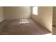 Open living room features neutral walls and carpet flooring, creating a blank canvas at 4300 N Lamont St # 232, Las Vegas, NV 89115