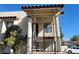 Stucco condo exterior with stairways leading to covered entries and parking at 4451 Rich Dr # D, Las Vegas, NV 89102