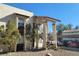 Well-maintained multi-unit exterior with stucco, covered stairways, and ample parking space at 4451 Rich Dr # D, Las Vegas, NV 89102