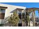Exterior shot of a multi-unit building with trees and covered stairways at 4451 Rich Dr # D, Las Vegas, NV 89102