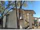 Charming exterior of a multi-unit dwelling with stucco and covered stairways for access to units at 4451 Rich Dr # D, Las Vegas, NV 89102