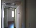 A hallway with doors leading to other rooms in the home and overhead lighting at 4451 Rich Dr # D, Las Vegas, NV 89102