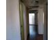 A hallway with doors leading to other rooms in the home and overhead lighting at 4451 Rich Dr # D, Las Vegas, NV 89102