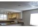 Bright kitchen with white cabinets and granite countertops in an open concept layout at 4451 Rich Dr # D, Las Vegas, NV 89102
