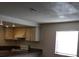 Bright, compact kitchen featuring granite counters, a range, and plenty of natural light at 4451 Rich Dr # D, Las Vegas, NV 89102