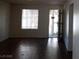 This living room features hardwood floors and natural light from the window and entrance at 4451 Rich Dr # D, Las Vegas, NV 89102