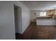 Open-concept living space with hardwood floors leading into the kitchen area at 4451 Rich Dr # D, Las Vegas, NV 89102