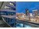 Balcony view featuring Las Vegas skyline during dusk, highlighting the architectural details of nearby buildings at 4471 Dean Martin Dr # 1707, Las Vegas, NV 89103
