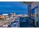 Balcony view showcasing Las Vegas skyline and bustling freeway at dusk, offering a glimpse of city living at 4471 Dean Martin Dr # 1707, Las Vegas, NV 89103