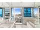 Modern bathroom featuring dual sinks, marble accents, and a large window with stunning city views at 4471 Dean Martin Dr # 1707, Las Vegas, NV 89103