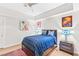 Comfortable bedroom with modern decor, wood floors, ceiling fan, and ample natural light at 4471 Dean Martin Dr # 1707, Las Vegas, NV 89103
