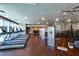 Bright gym features cardio machines, weight machines, and ample workout space with wood floors at 4471 Dean Martin Dr # 1707, Las Vegas, NV 89103