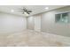 Spacious bedroom featuring a ceiling fan, recessed lights, and tile flooring at 4676 E Alexander Rd, Las Vegas, NV 89115