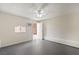 This room features a textured wall, a window, and a white ceiling fan at 4676 E Alexander Rd, Las Vegas, NV 89115